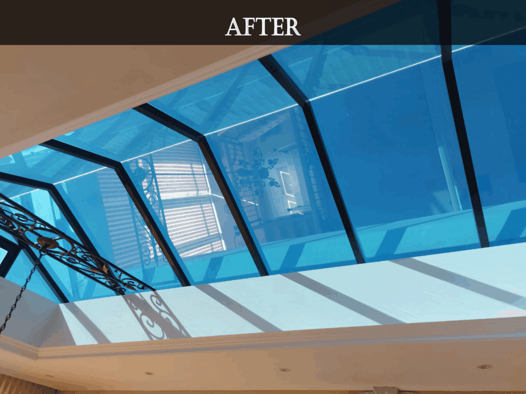 Renovated skylight in a modern residential living room with clear glass panels and natural light.