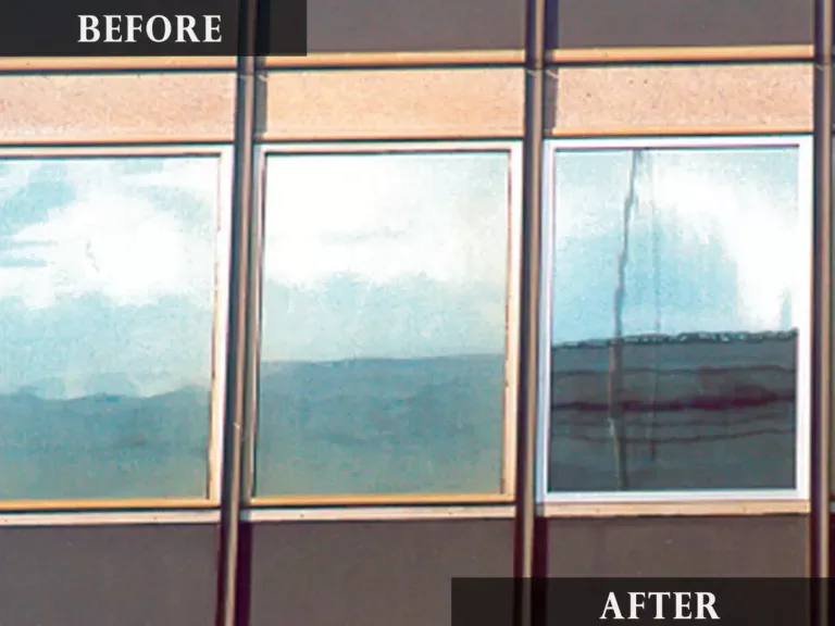 Close-up view of dirty vs. clean commercial building windows after professional cleaning