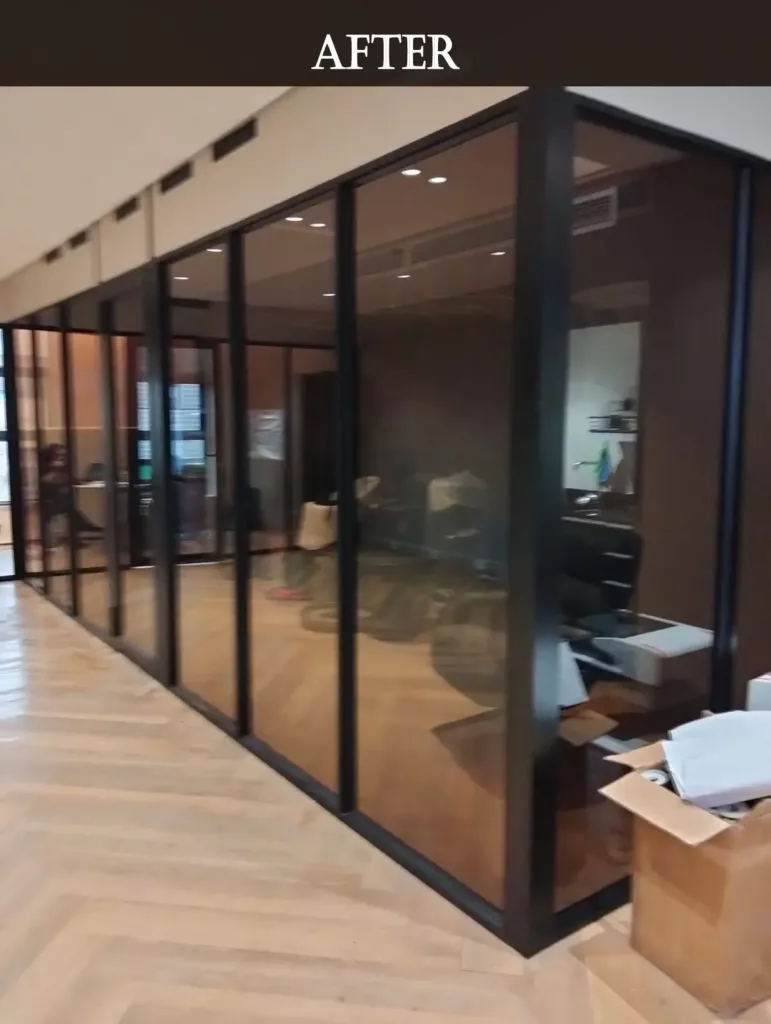 Modern office glass partition after renovation with clean and polished design.