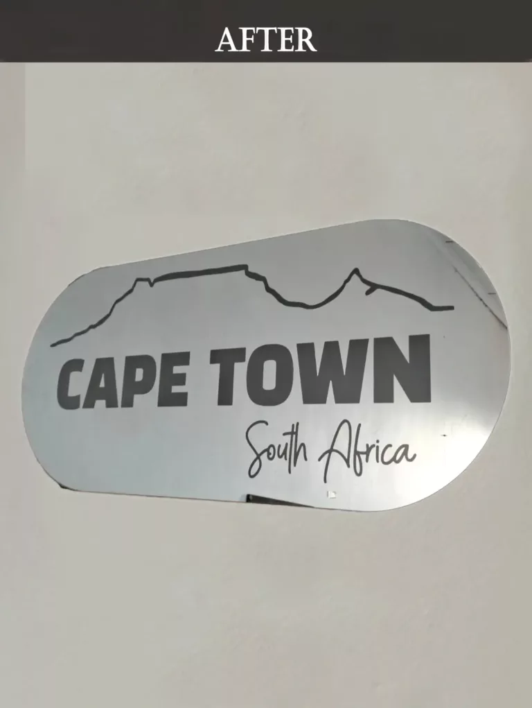 Wall mirror with engraved Table Mountain silhouette and “Cape Town, South Africa” text.