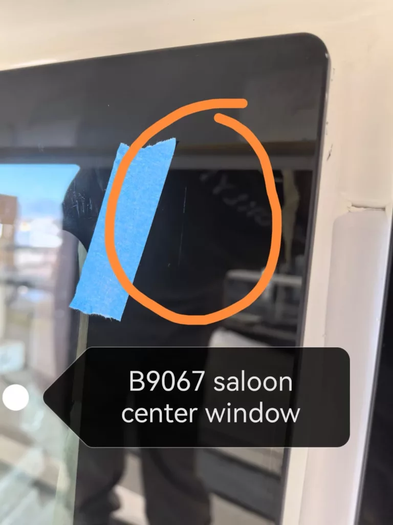 Scratch on B9067 saloon center window before removal service